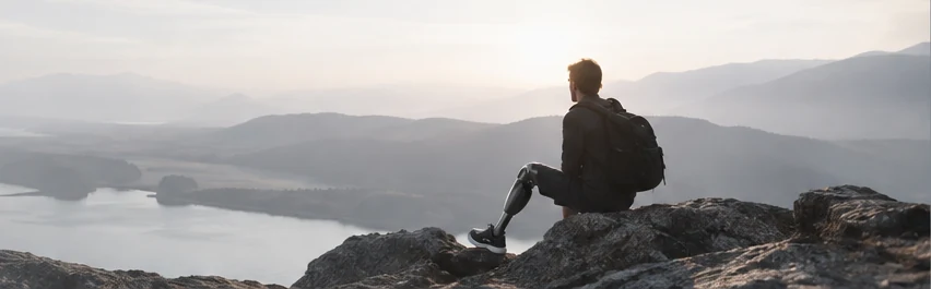 Concept photograph of a person looking across a mountain landscape